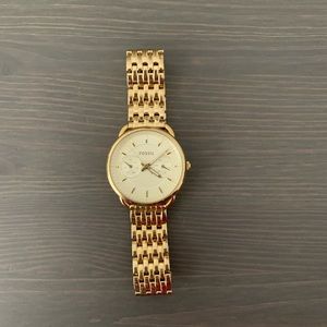 Gold fossil watch
